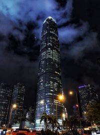 Low angle view of illuminated buildings against sky at night