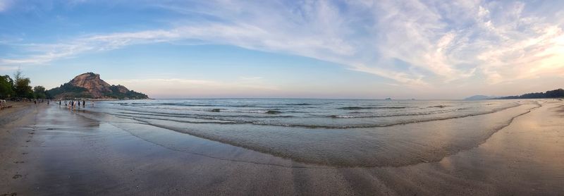 Scenic view of beach against sky during sunset