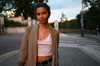 Portrait of woman standing outdoors