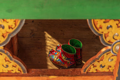 High angle view of multi colored shoes on table