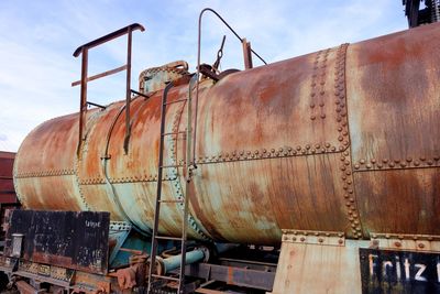 Low angle view of abandoned train against sky