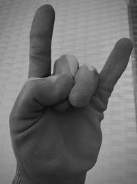 Close-up of human hand against blurred background