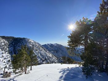 Scenic view of snow covered mountains against sky