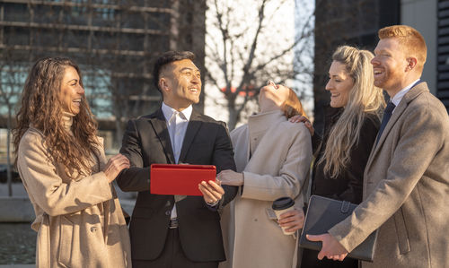 Portrait of young woman using mobile phone