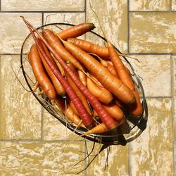 High angle view of vegetables on table against wall
