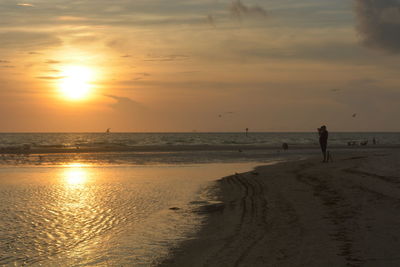 Scenic view of sea at sunset