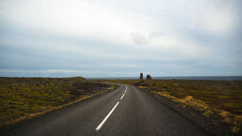 Road amidst landscape against sky