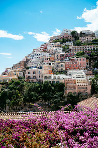 Scenic view of pink and buildings against sky