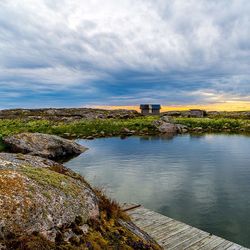 Scenic view of landscape against cloudy sky