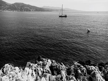 Sailboats on sea against sky