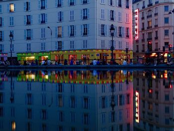 View of illuminated buildings in city