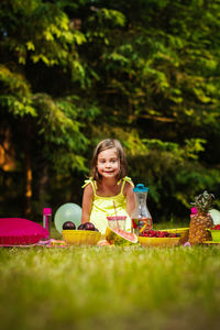 Portrait of girl sitting in park