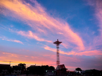 Low angle view of silhouette buildings against sky during sunset