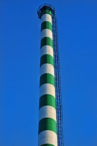 Low angle view of lighthouse against blue sky