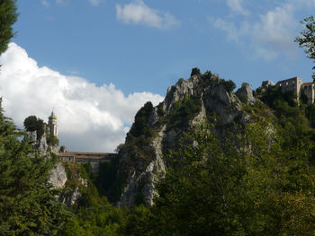 Panoramic view of trees and mountains against sky