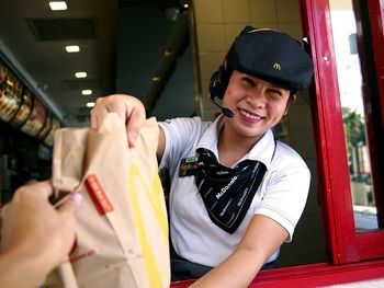 Portrait of a smiling young woman in store