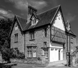 Exterior of old building by street against sky