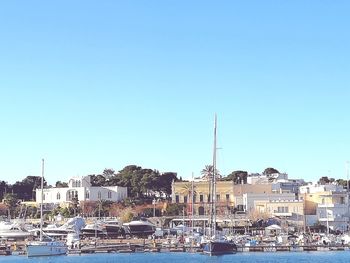 Boats moored at harbor