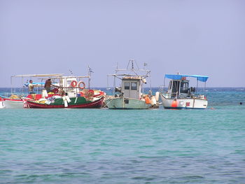Ship in sea against clear sky