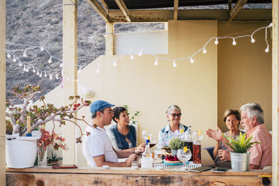 Group of people by the wall