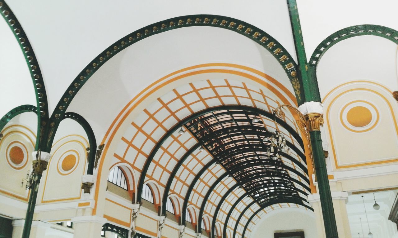 architecture, built structure, low angle view, indoors, building exterior, arch, ceiling, building, architectural feature, pattern, design, window, no people, day, in a row, ornate, modern, decoration, wall - building feature, railing