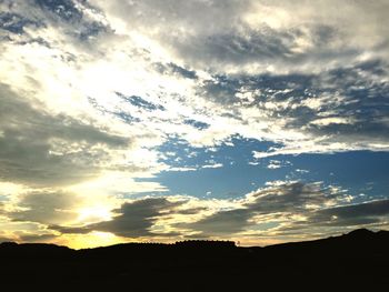 Low angle view of dramatic sky during sunset