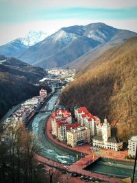 High angle view of townscape and mountains against sky