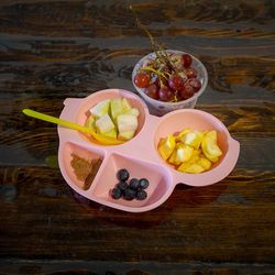 High angle view of fruits in plate on table