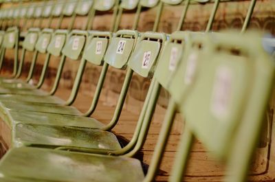 Empty chairs arranged in stadium