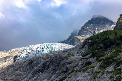 Low angle view of trient glacier against cloudy sky