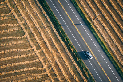 High angle view of car on road amidst field