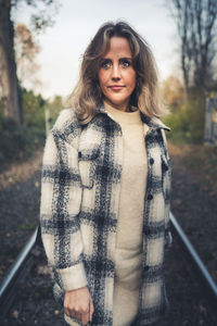 Portrait of woman standing on the railway