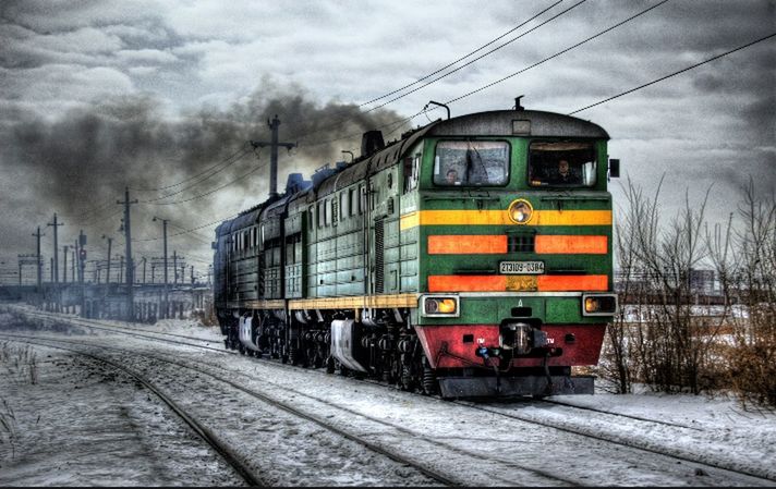 railroad track, transportation, rail transportation, public transportation, train - vehicle, mode of transport, train, passenger train, sky, cloud - sky, railroad station, railroad station platform, building exterior, land vehicle, travel, architecture, cloudy, built structure, day, freight transportation