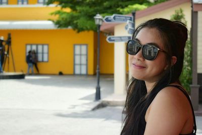 Portrait of young woman wearing sunglasses