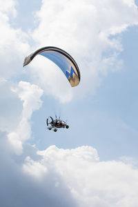 Low angle view of parachute against sky