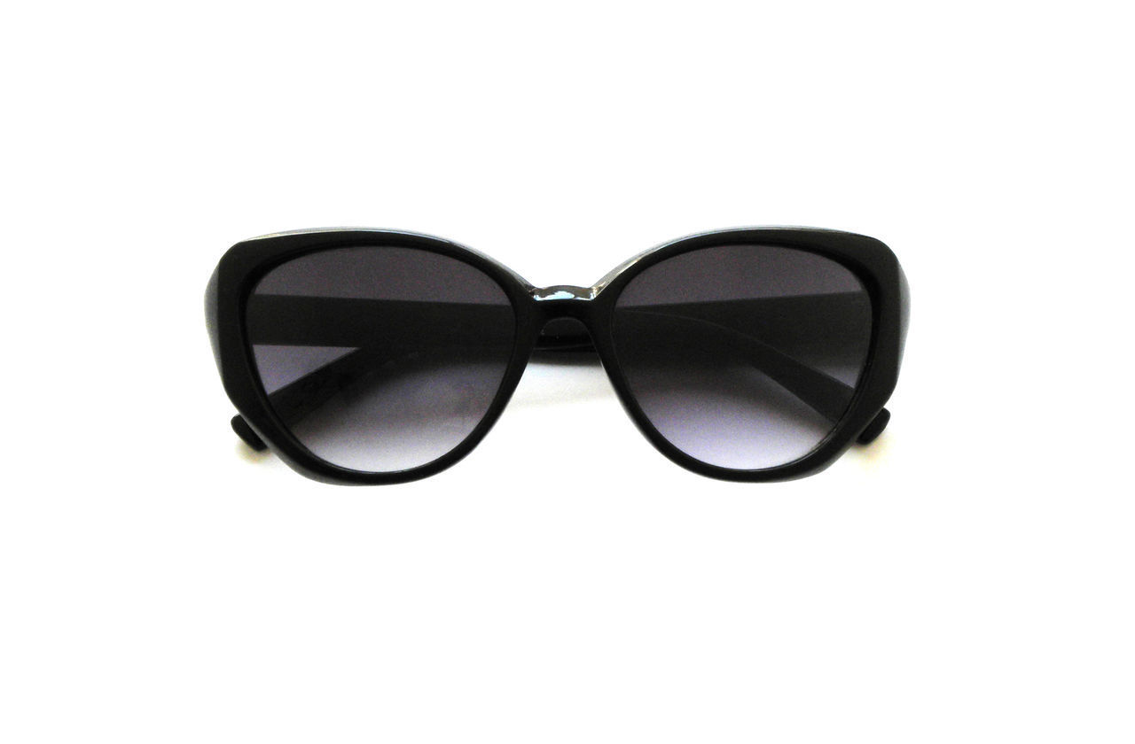 REFLECTION OF SUNGLASSES ON WHITE BACKGROUND