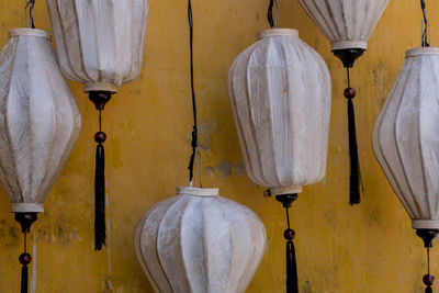 Clothes hanging against white wall