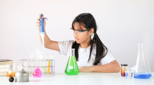 Girl experimenting at laboratory