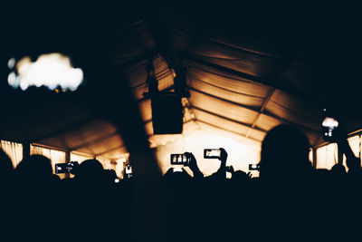 Silhouette people at music concert