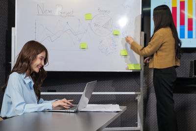 Portrait of businesswoman working in office