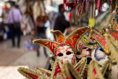 Close-up of venetian masks at market