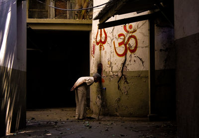 Full length of man standing in abandoned building