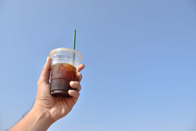 My iced coffee on the sky clean on background.