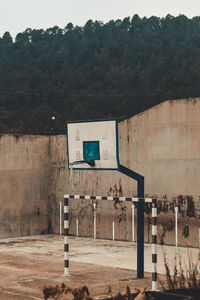 View of basketball hoop against trees