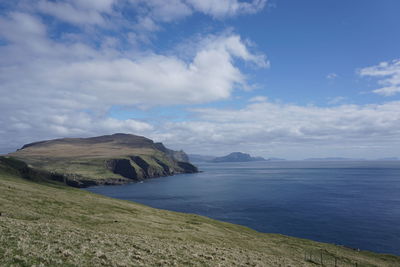 Scenic view of sea against cloudy sky