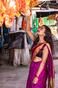 Young woman smiling in traditional clothing