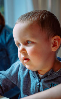 Close-up of cute baby boy at home