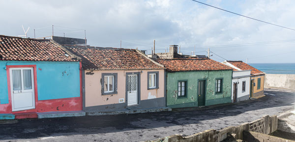 Houses against sky in city