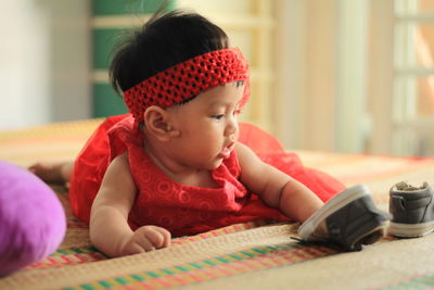 Portrait of cute baby girl at home