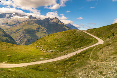 View of the alps over zermatt near gornergrat with a hiking path road